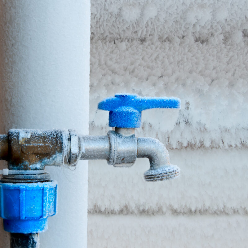 Frost-covered outdoor faucet.