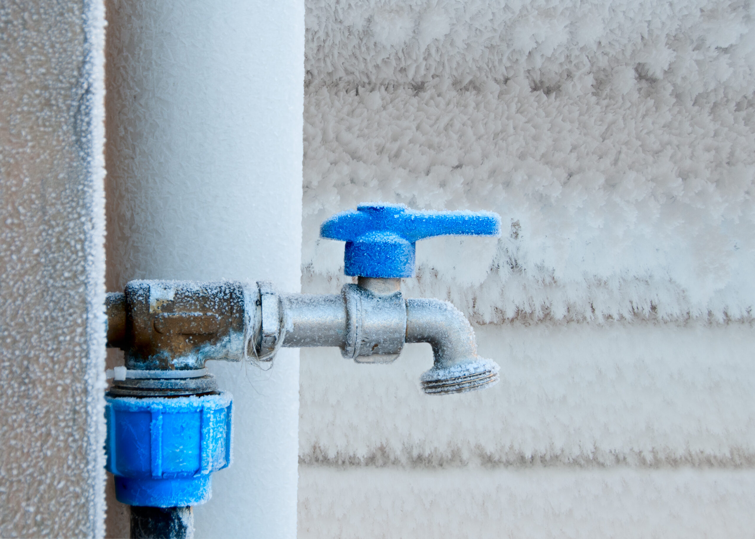 Frost-covered outdoor faucet.